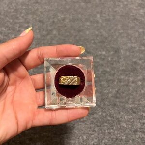 Gold and Silver Ring in Display Case